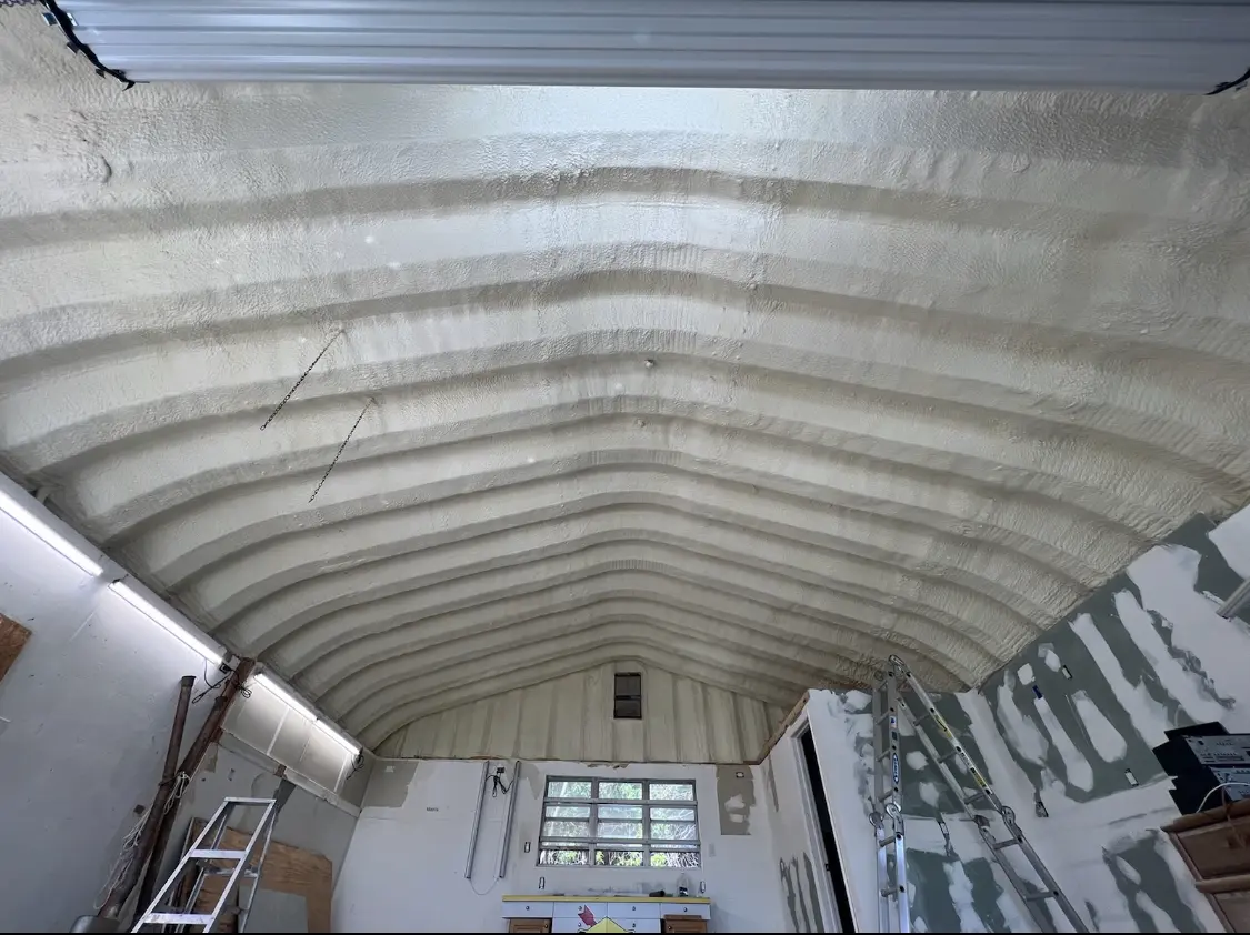 Spray polyurethane foam applied to the underside of a metal roof deck in Yorba Linda